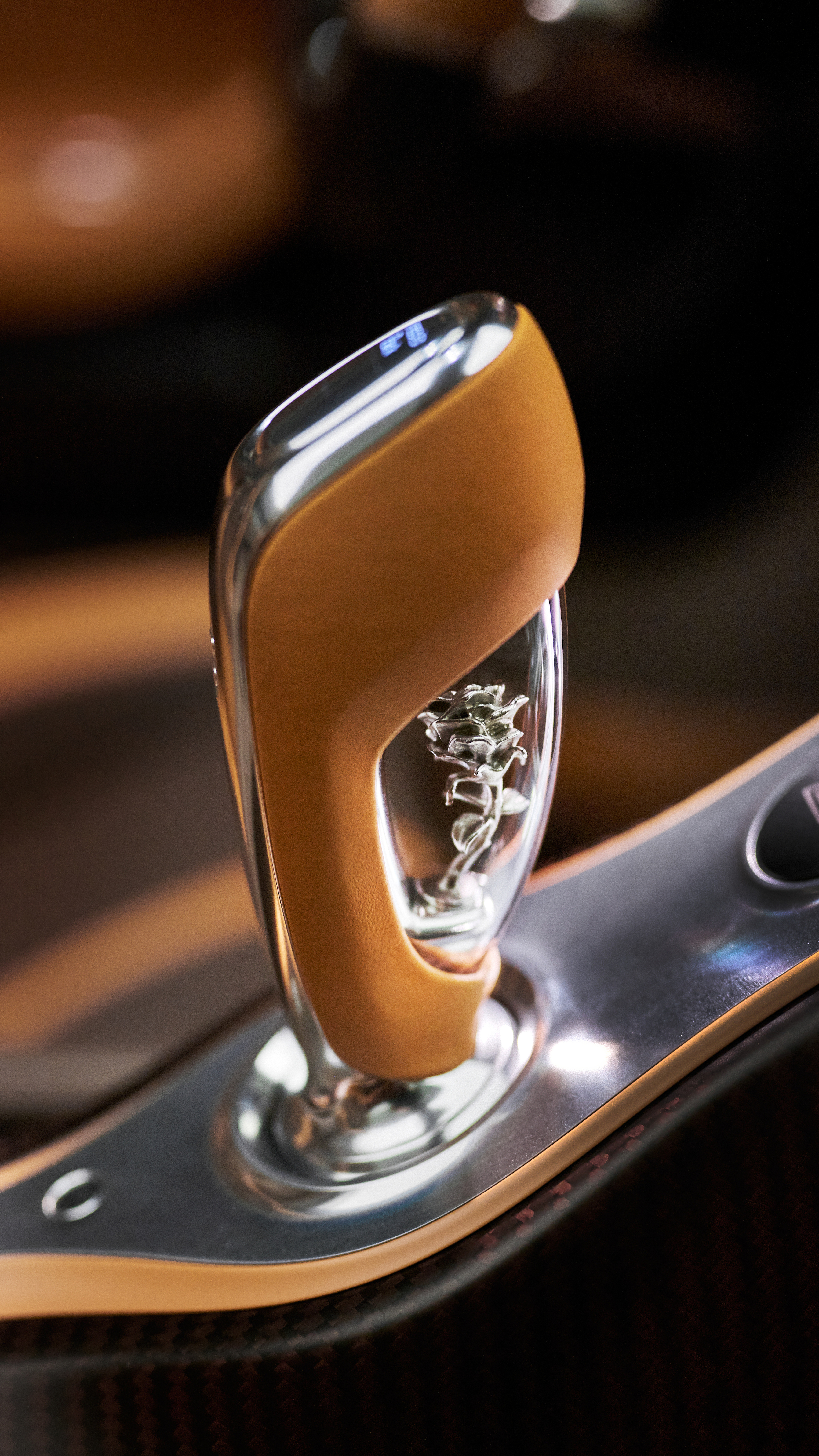 The Bugatti W16 Mistral ‘Le Retour du Jeune Prince’ features an intricately sculpted silver rose, beautifully encased inside the gear shifter.